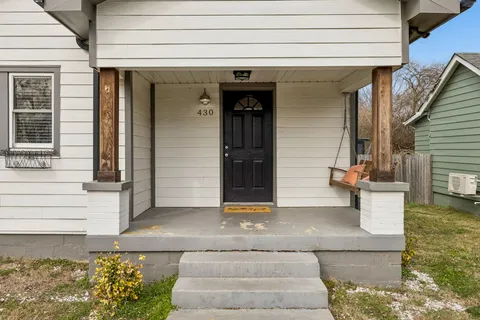 a view of a kitchen with a stove cabinets and wooden floor