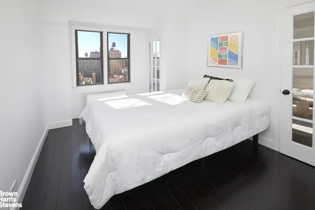 a living room with furniture wooden floor and a table