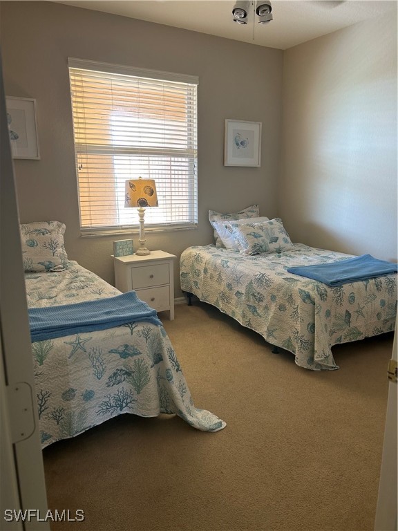Undisclosed Address Estero, FL 33967 - Photo 13 of 18 a bedroom with two beds and a window