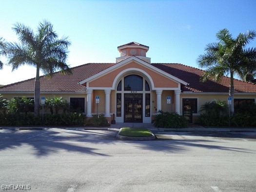 Undisclosed Address Estero, FL 33967 - Photo 16 of 18 a front view of a house with garden