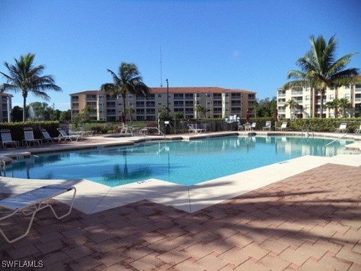 Undisclosed Address Estero, FL 33967 - Photo 17 of 18 a swimming pool with outdoor seating and yard