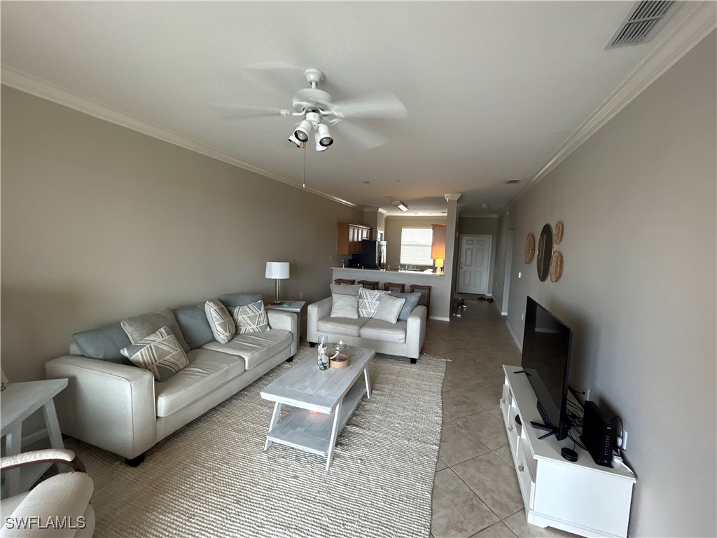 Undisclosed Address Estero, FL 33967 - Photo 6 of 18 a living room with furniture and a fireplace