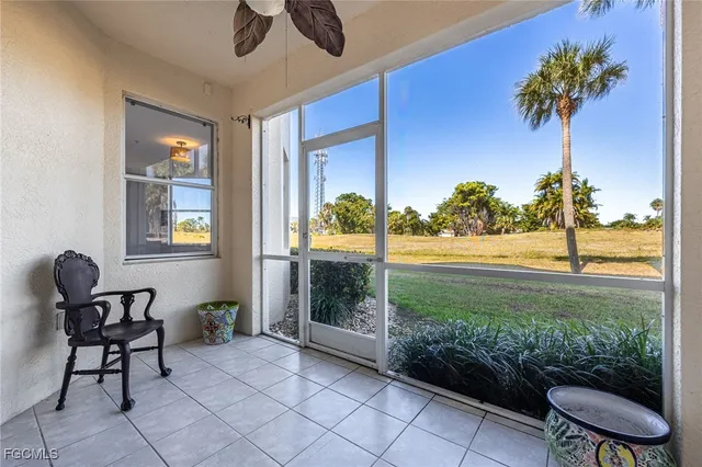 a view of a porch with furniture and garden