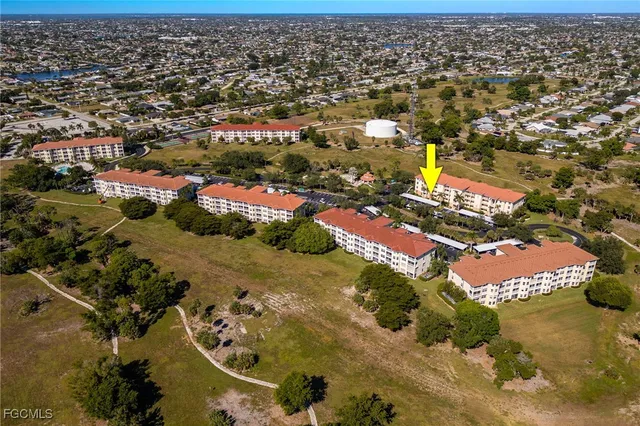 an aerial view of a residential houses with outdoor space