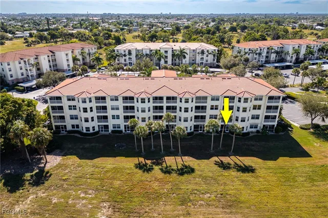 a view of swimming pool with outdoor seating and yard
