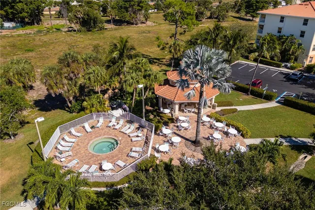 an aerial view of a house with a swimming pool