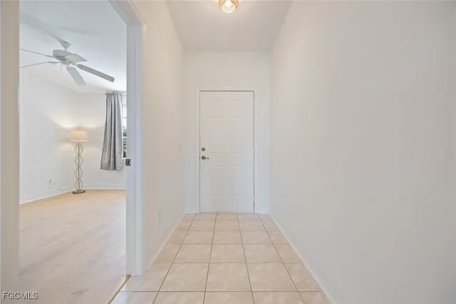 a view of a room with a walk in closet and mirror
