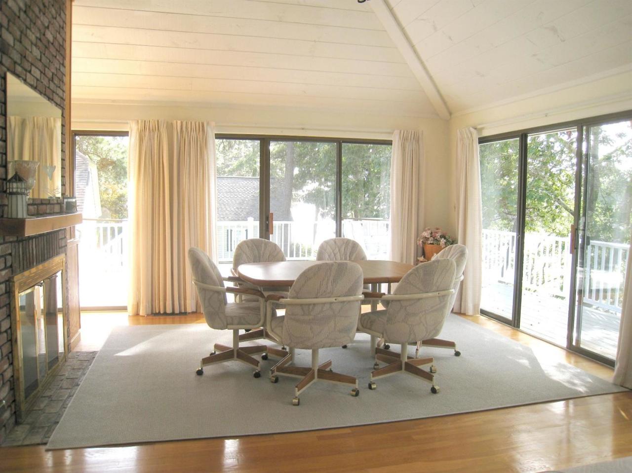 72 Clam Shell Point Lane Cotuit, MA 02635 - Photo 11 of 35 a living room filled with furniture