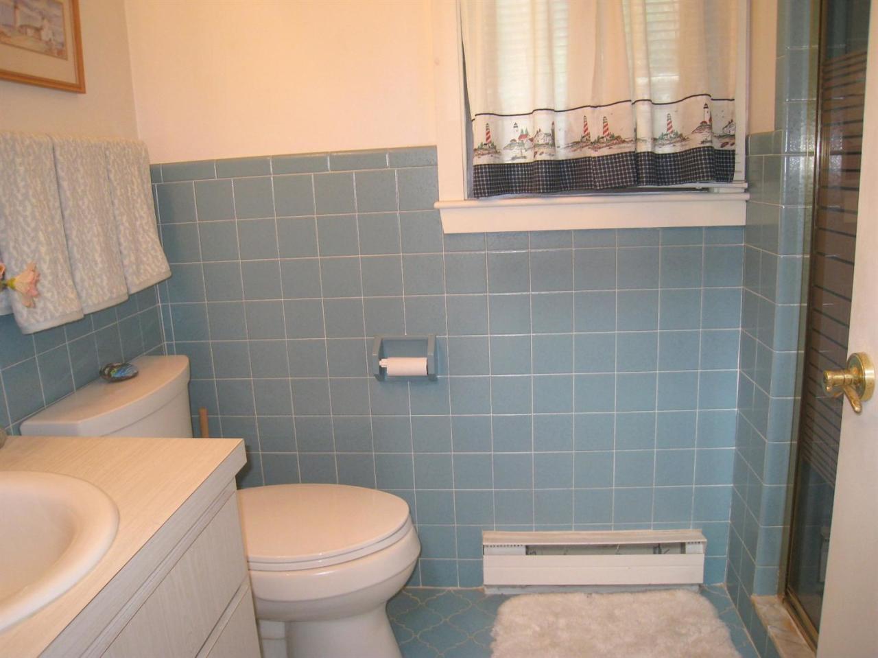 72 Clam Shell Point Lane Cotuit, MA 02635 - Photo 16 of 35 a bathroom with a toilet and a sink