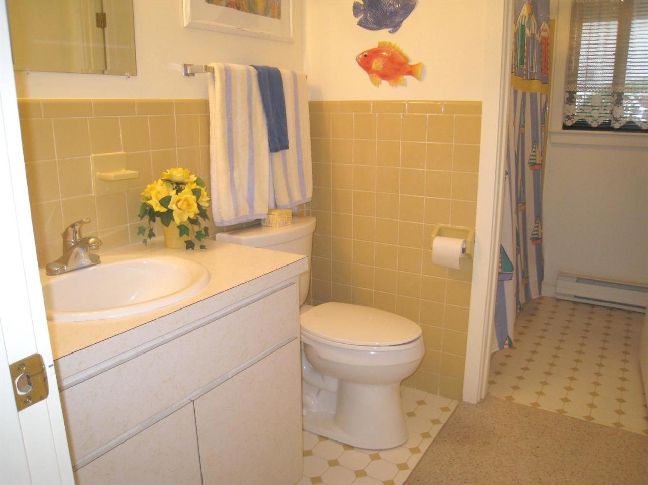 72 Clam Shell Point Lane Cotuit, MA 02635 - Photo 19 of 35 a bathroom with a sink toilet and shower