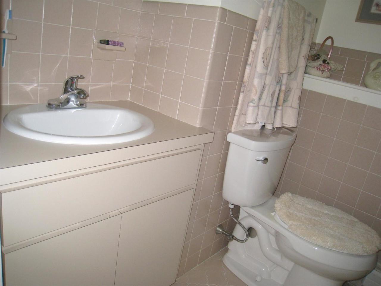 72 Clam Shell Point Lane Cotuit, MA 02635 - Photo 25 of 35 a bathroom with a sink toilet and shower