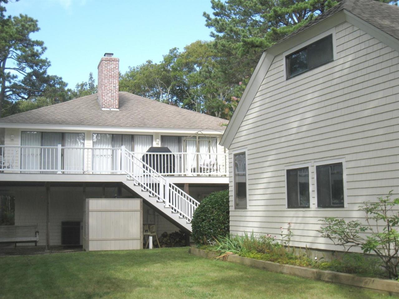 72 Clam Shell Point Lane Cotuit, MA 02635 - Photo 30 of 35 a front view of a house with a yard