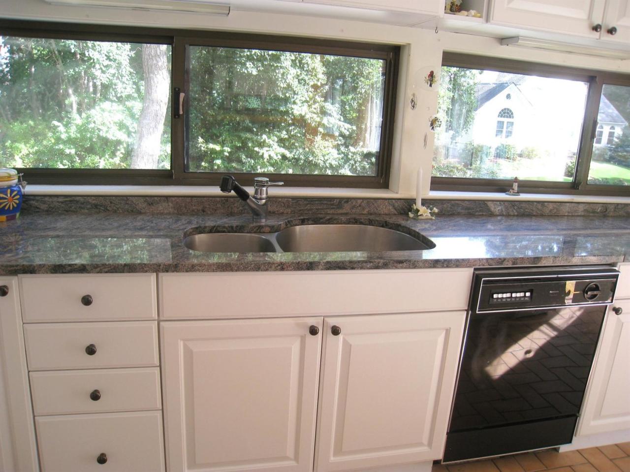 72 Clam Shell Point Lane Cotuit, MA 02635 - Photo 8 of 35 a kitchen with granite countertop a sink and a window