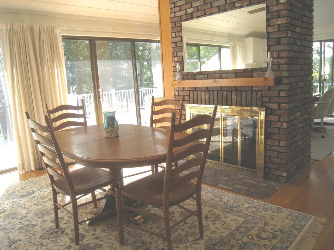 72 Clam Shell Point Lane Cotuit, MA 02635 - Photo 9 of 35 a dining room with furniture window and outside view