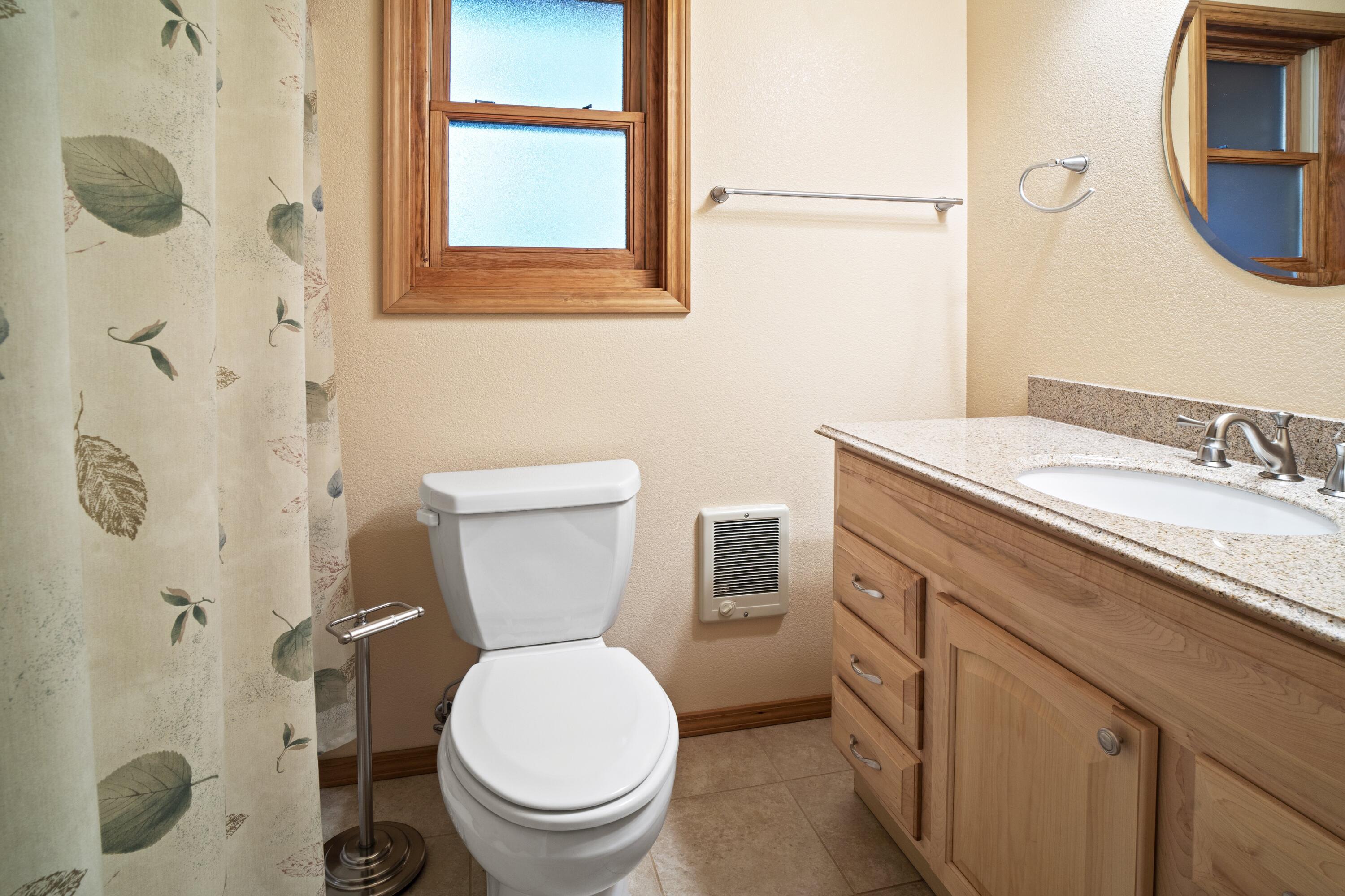 2021 Queens Branch Road Rogue River, OR 97537 - Photo 19 of 37 a bathroom with a granite countertop toilet sink and a mirror