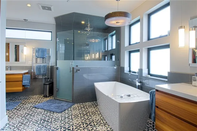 a bathroom with a sink a toilet and bathtub