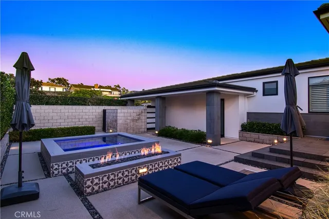 a view of a backyard with sitting area