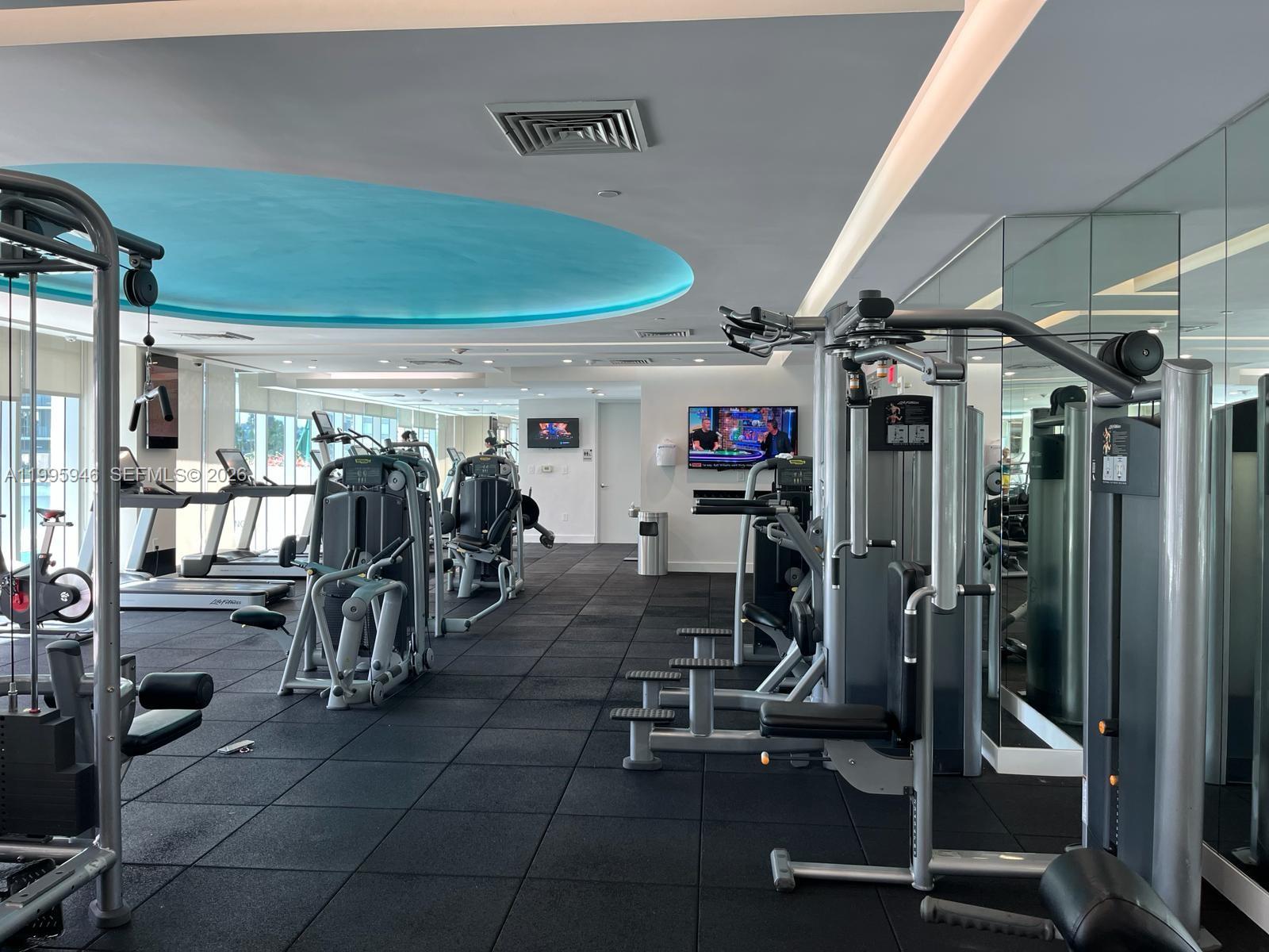 55 Southeast 6th Street, Unit 2005 Miami, FL 33131 - Photo 33 of 40 a view of a room with gym equipment