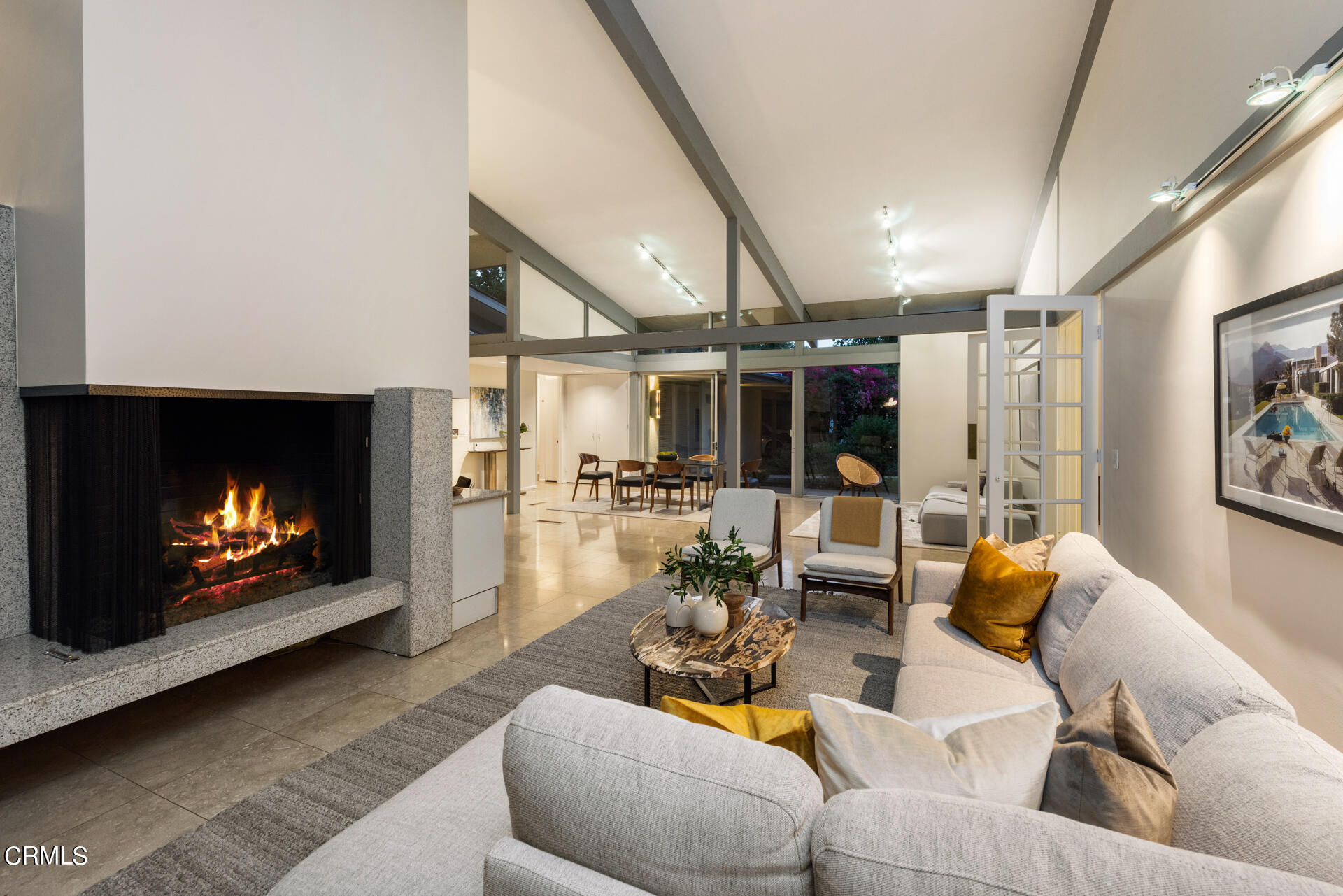 Undisclosed Address San Marino, CA 91108 - Photo 11 of 33 a living room with furniture a fireplace and a flat screen tv