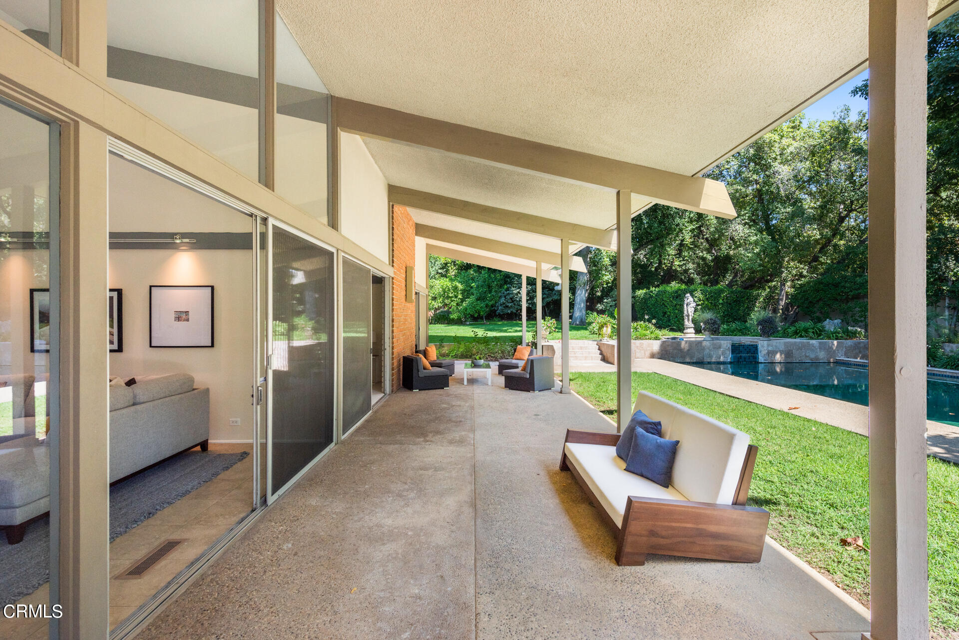 Undisclosed Address San Marino, CA 91108 - Photo 24 of 33 a view of a patio with couches chairs and floor to ceiling window