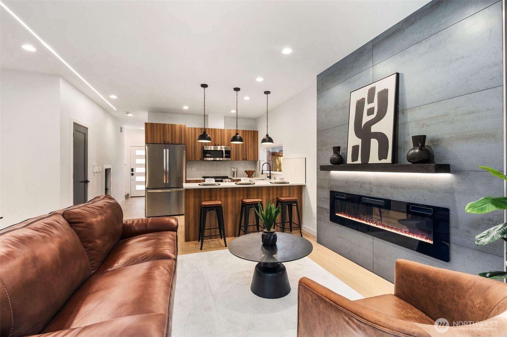 3807 Northeast 89th Street Seattle, WA 98115 - Photo 11 of 32 a living room with furniture and a fireplace