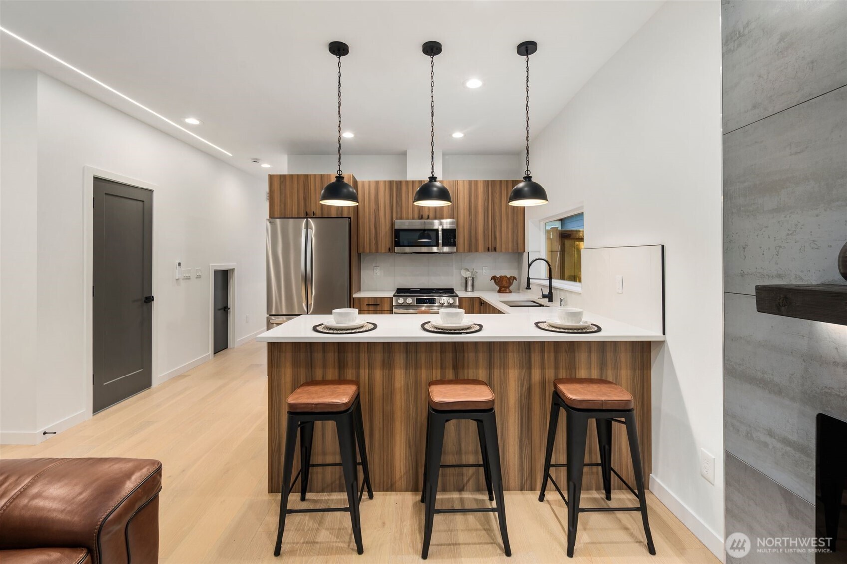 3807 Northeast 89th Street Seattle, WA 98115 - Photo 12 of 32 a kitchen with stainless steel appliances kitchen island a chandelier