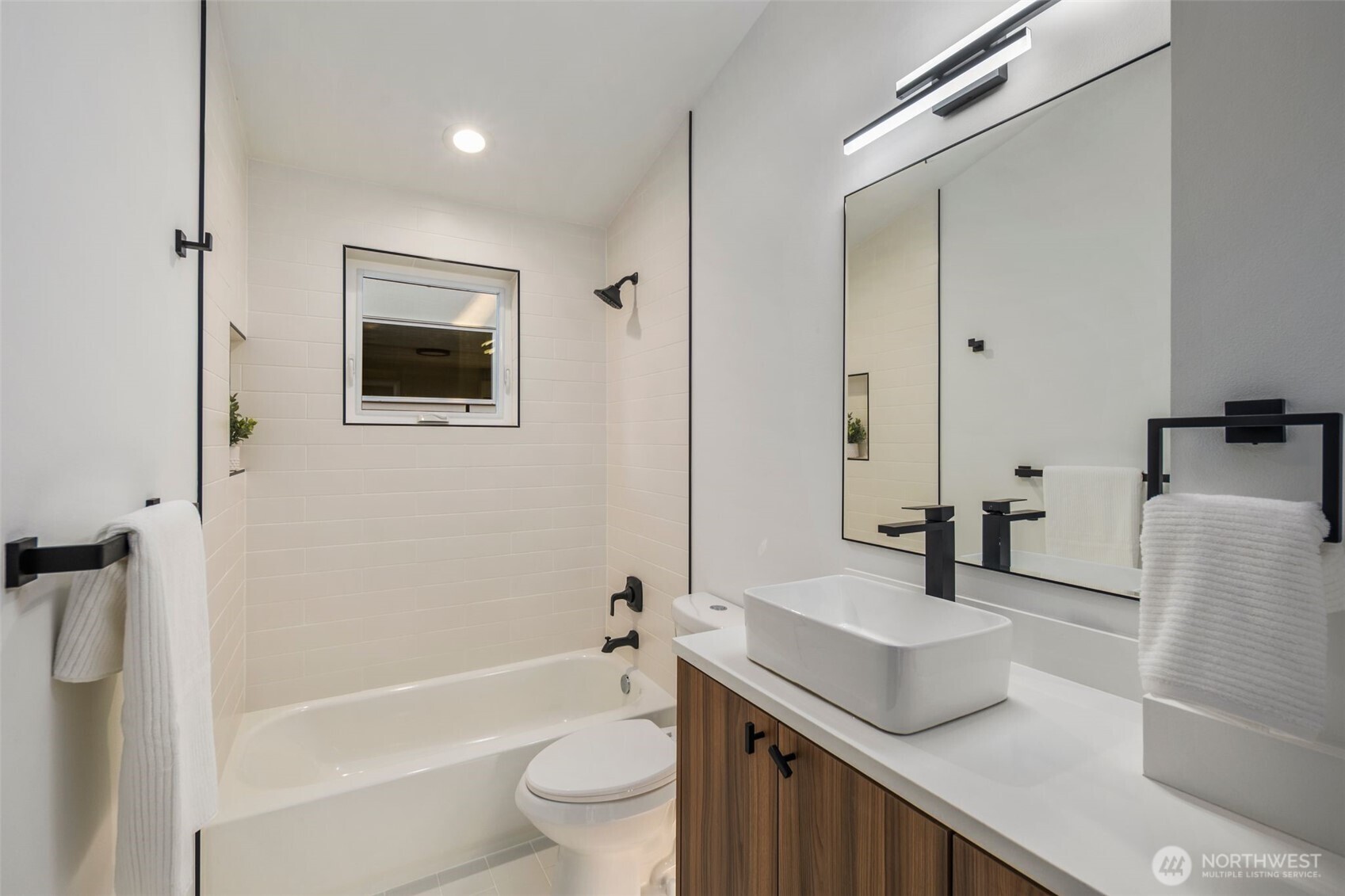 3807 Northeast 89th Street Seattle, WA 98115 - Photo 16 of 32 a bathroom with a granite countertop sink toilet and shower