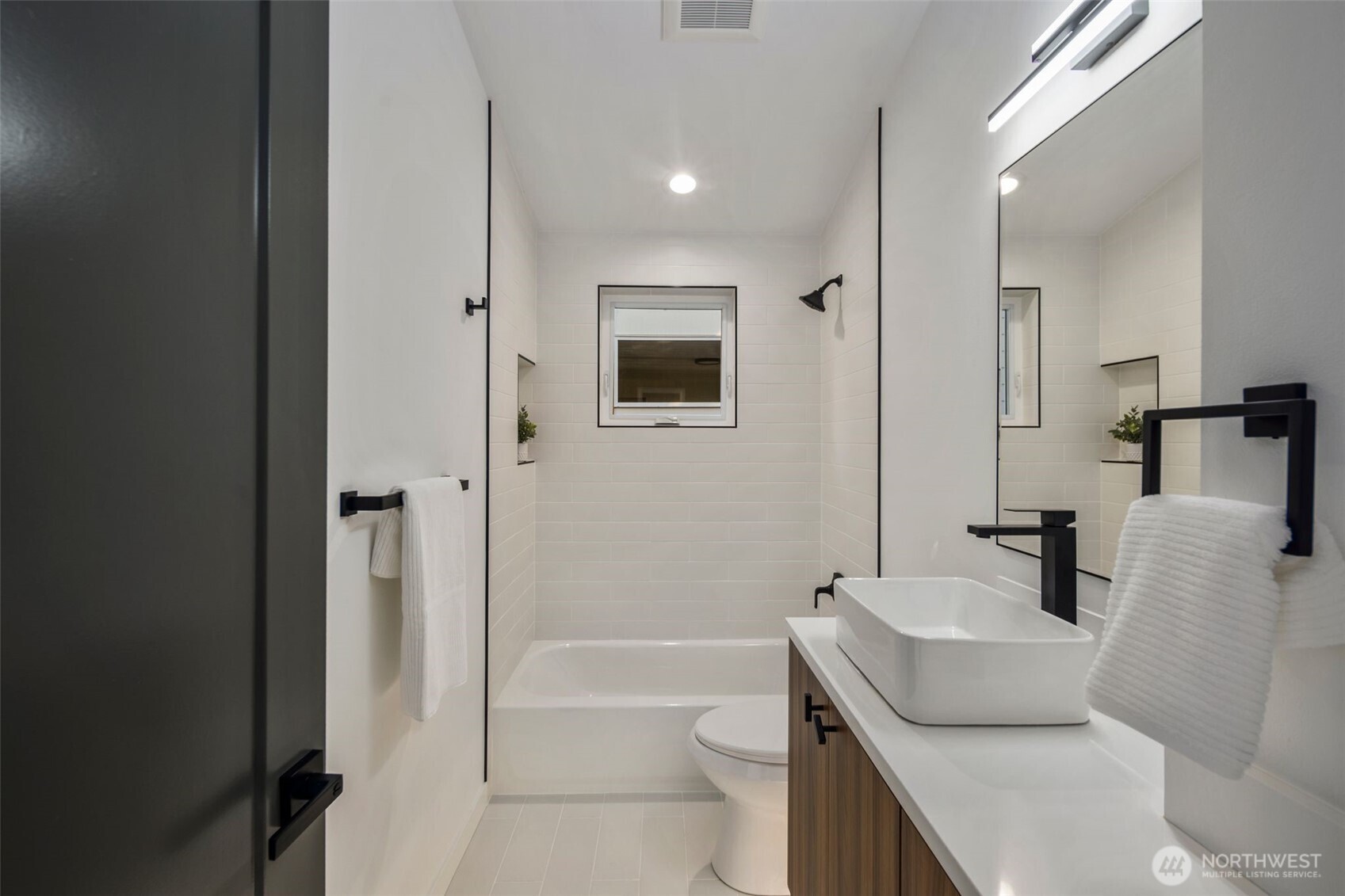 3807 Northeast 89th Street Seattle, WA 98115 - Photo 17 of 32 a bathroom with a sink toilet and shower