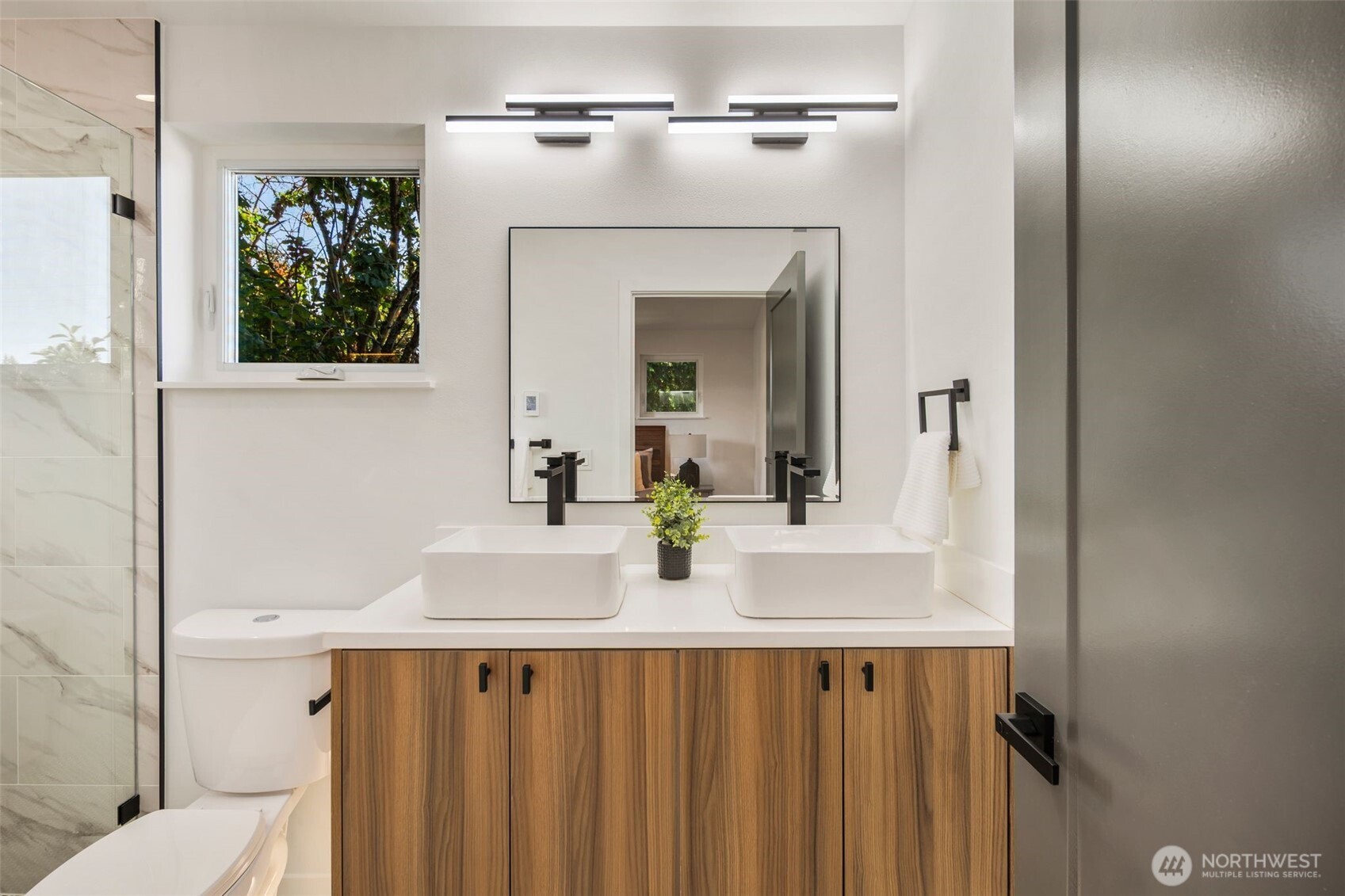 3807 Northeast 89th Street Seattle, WA 98115 - Photo 21 of 32 a bathroom with a sink and a mirror