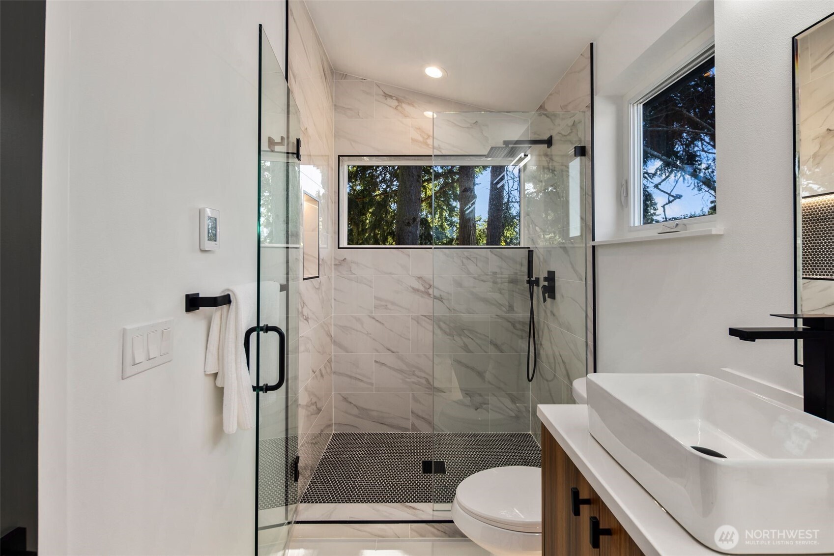 3807 Northeast 89th Street Seattle, WA 98115 - Photo 23 of 32 a bathroom with a sink toilet and shower