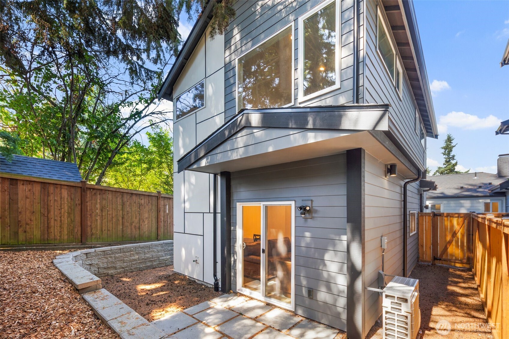 3807 Northeast 89th Street Seattle, WA 98115 - Photo 25 of 32 a view of a house with a small backyard and a tub