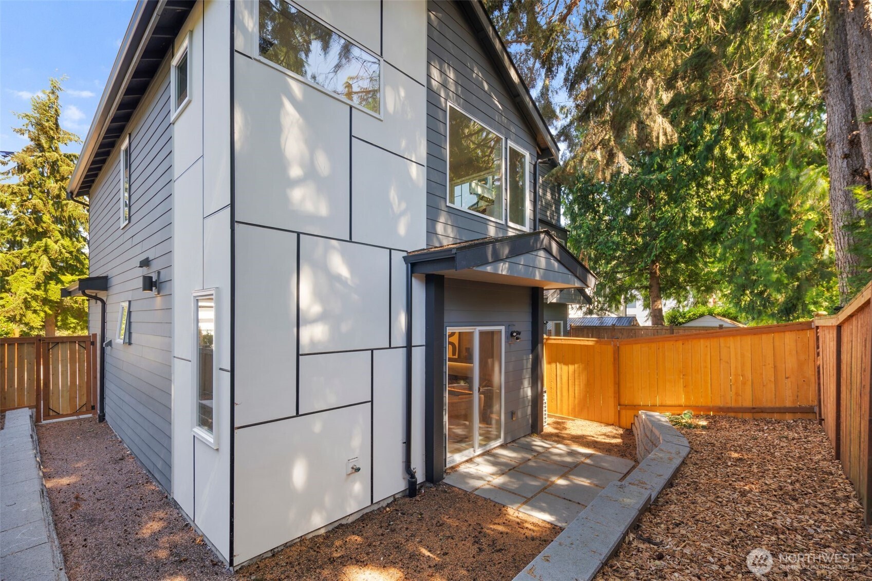 3807 Northeast 89th Street Seattle, WA 98115 - Photo 26 of 32 a view of a house with a large tree