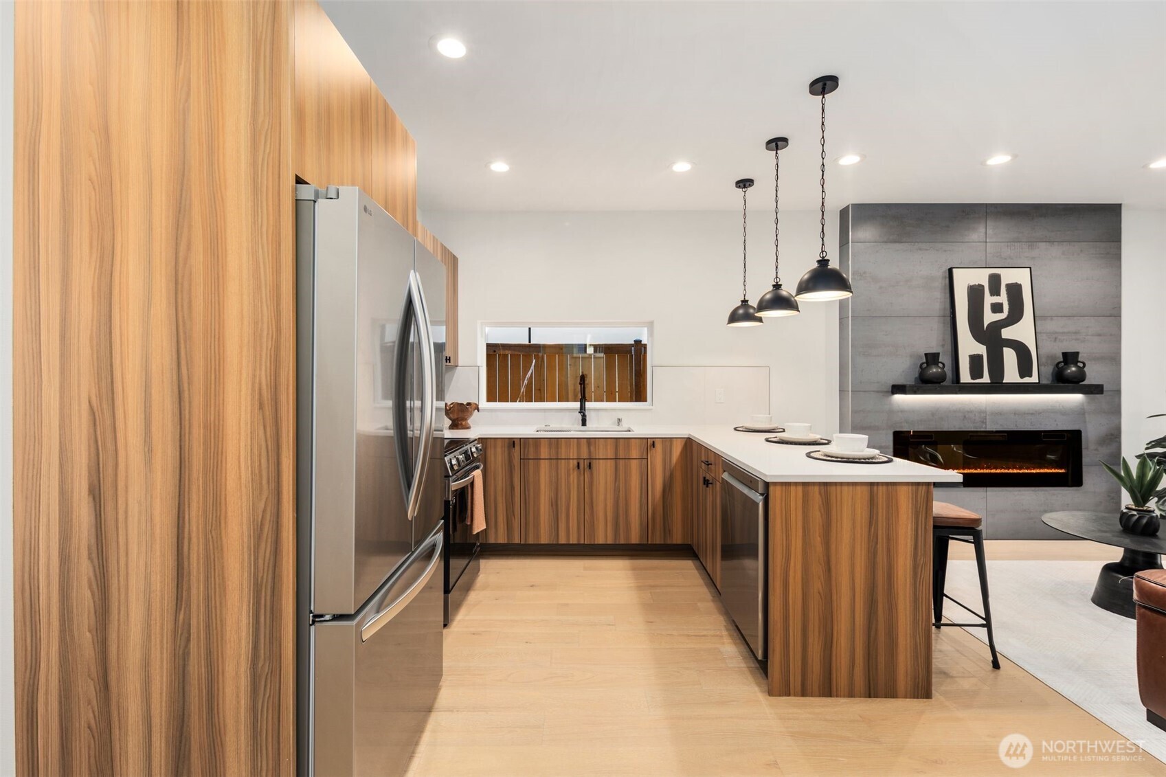 3807 Northeast 89th Street Seattle, WA 98115 - Photo 6 of 32 a kitchen with stainless steel appliances a refrigerator and a stove