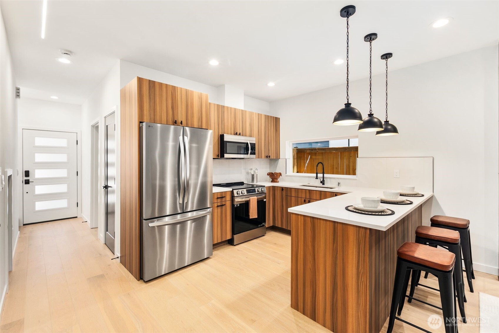 3807 Northeast 89th Street Seattle, WA 98115 - Photo 7 of 32 a kitchen with kitchen island a counter top space appliances and cabinets