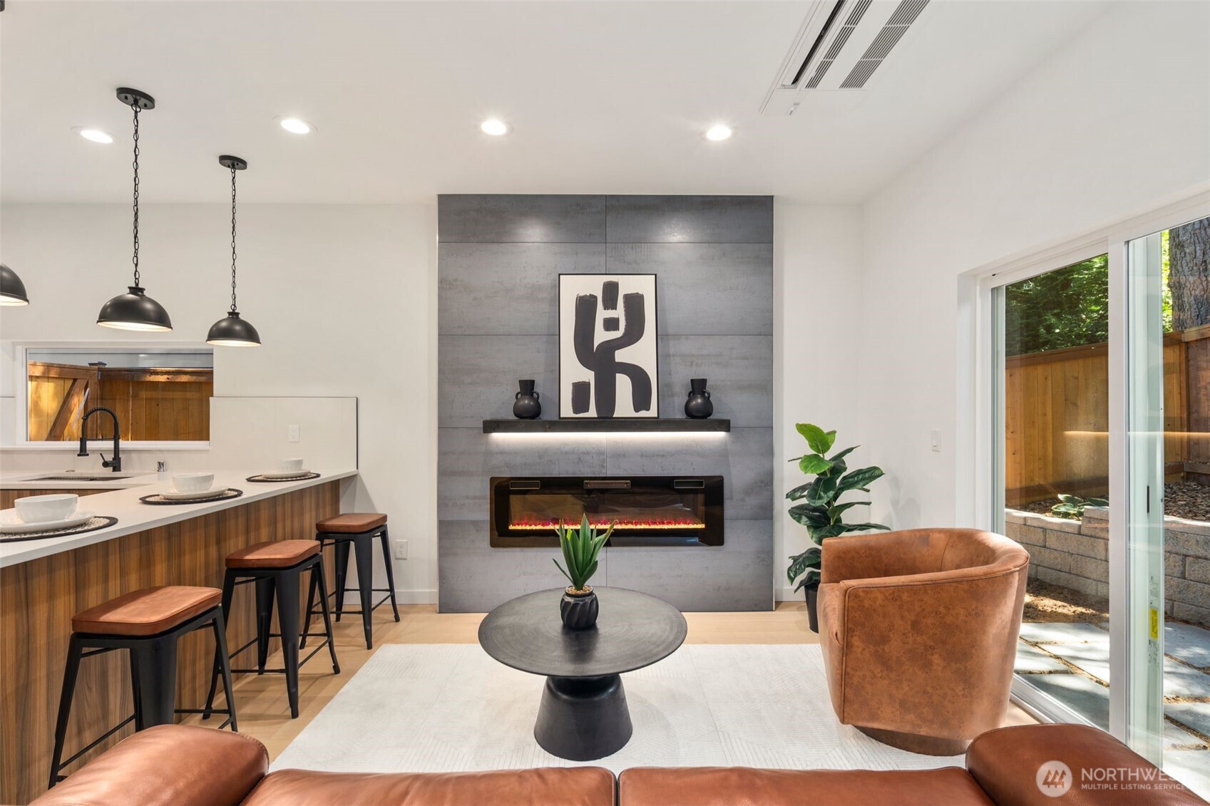 3807 Northeast 89th Street Seattle, WA 98115 - Photo 8 of 32 a living room with furniture a chandelier and a fireplace