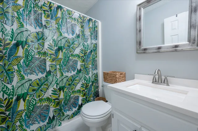 a bathroom with a toilet and a sink