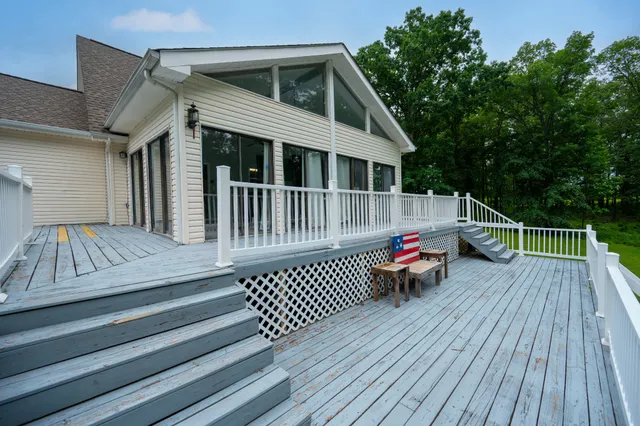 a view of outdoor space with deck and flat screen tv