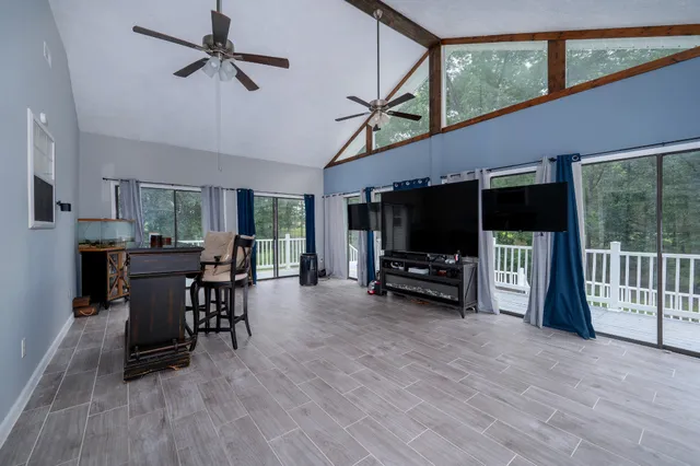 a view of a livingroom with furniture and a flat screen tv