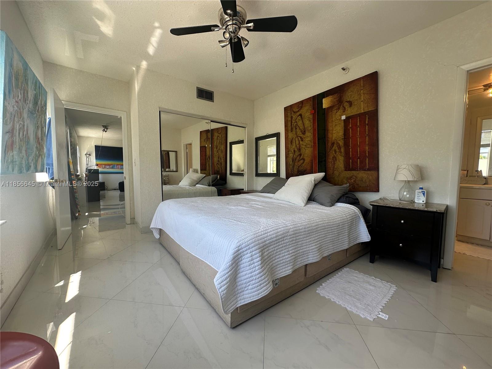 802 Euclid Avenue, Unit 305 Miami Beach, FL 33139 - Photo 11 of 13 a bedroom with a bed and window