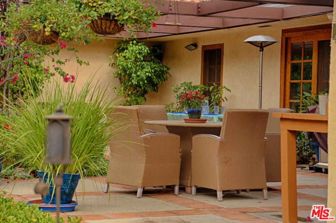 11345 Riverwood Drive Tujunga, CA 91042 - Photo 18 of 54 a potted plant sitting in front of a house