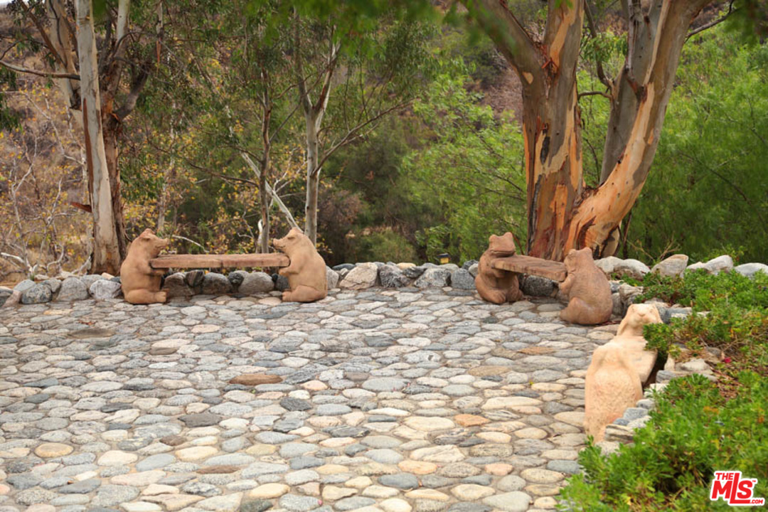 11345 Riverwood Drive Tujunga, CA 91042 - Photo 38 of 54 a backyard of a house with table and chairs