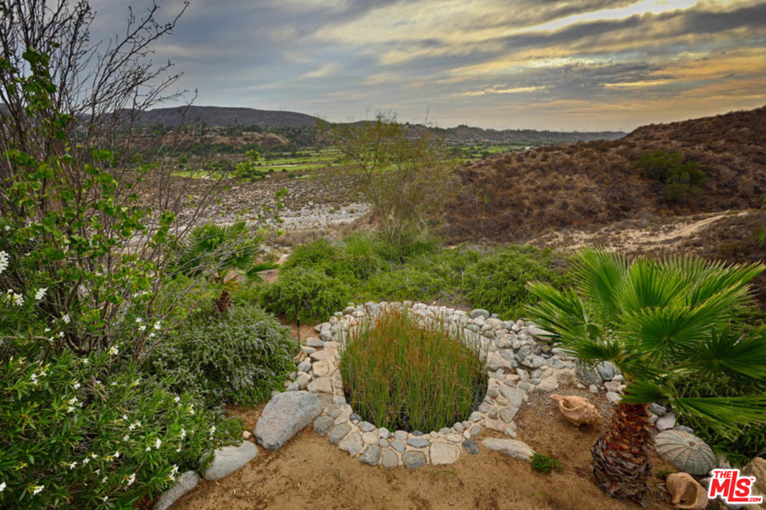 11345 Riverwood Drive Tujunga, CA 91042 - Photo 43 of 54 a view of a lake with a mountain in the background