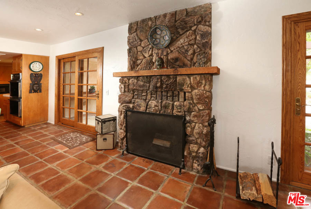 11345 Riverwood Drive Tujunga, CA 91042 - Photo 7 of 54 a living room with a fireplace