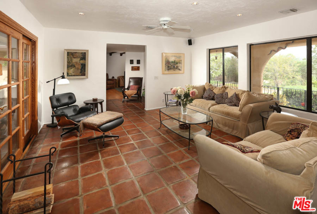 11345 Riverwood Drive Tujunga, CA 91042 - Photo 9 of 54 a living room with furniture a large window and a rug