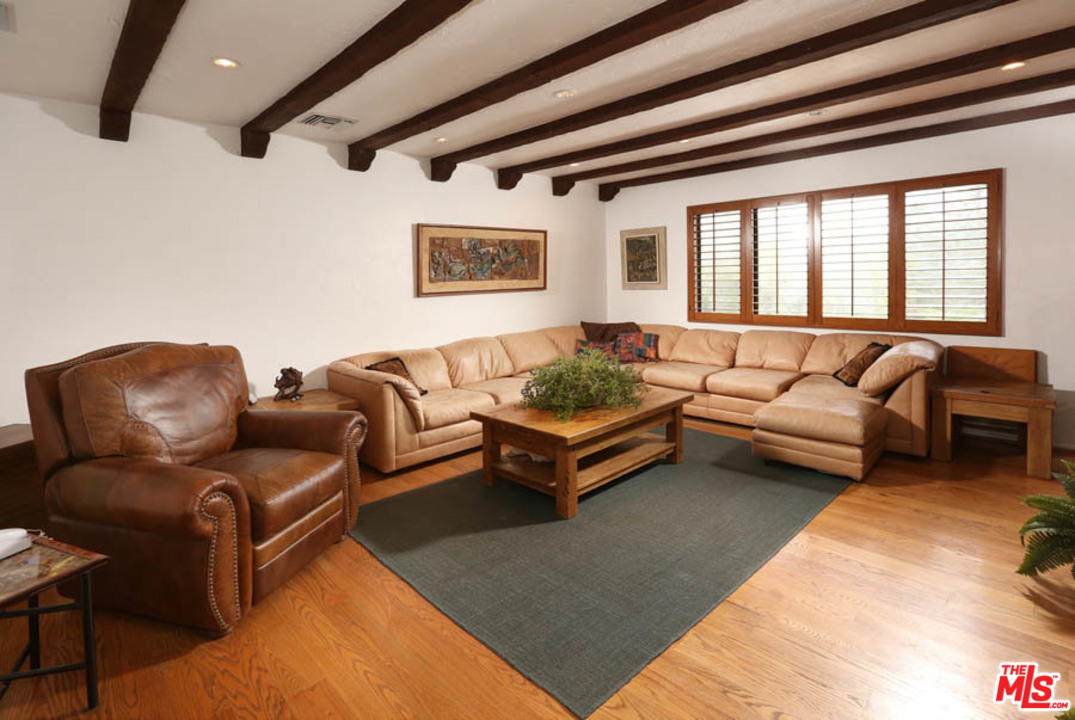 11345 Riverwood Drive Tujunga, CA 91042 - Photo 10 of 54 a living room with furniture and a potted plant
