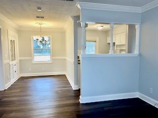 5815 Valleybrook Road Columbus, GA 31907 - Photo 13 of 14 an empty room with wooden floor and windows