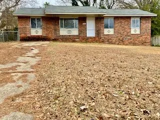 a front view of a house with yard