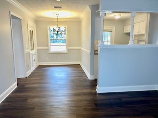 5815 Valleybrook Road Columbus, GA 31907 - Photo 4 of 14 wooden floor in an empty room with a window