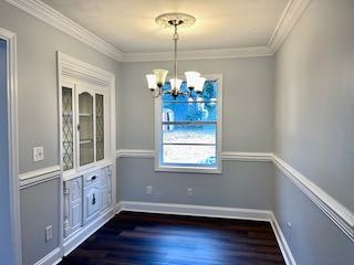 5815 Valleybrook Road Columbus, GA 31907 - Photo 6 of 14 a view of an empty room with wooden floor and a window