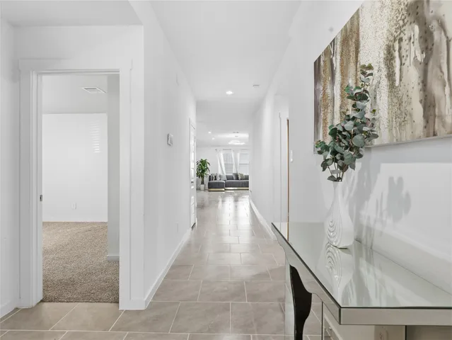 a view of a hallway view with wooden floor